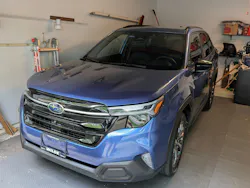 Blue Subaru Forrester in a garage Blue Subaru Forrester in a garage