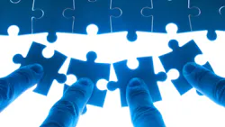 puzzle pieces being pushed into place puzzle pieces being pushed into place