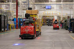 Automatic Guided Vehicles (AGVs) pull trains of product through the plant. Automatic Guided Vehicles (AGVs) pull trains of product through the plant.