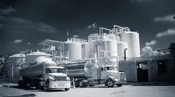 storage tanks with a semi in front of them. storage tanks with a semi in front of them.