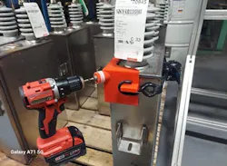 A 3D-printed assembly aid (in red). A 3D-printed assembly aid (in red).