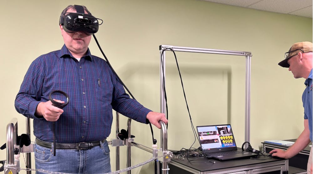 69026a74dc03f6662ad4bcf5 Dennis Scimeca Wearing Vr Rig Hero