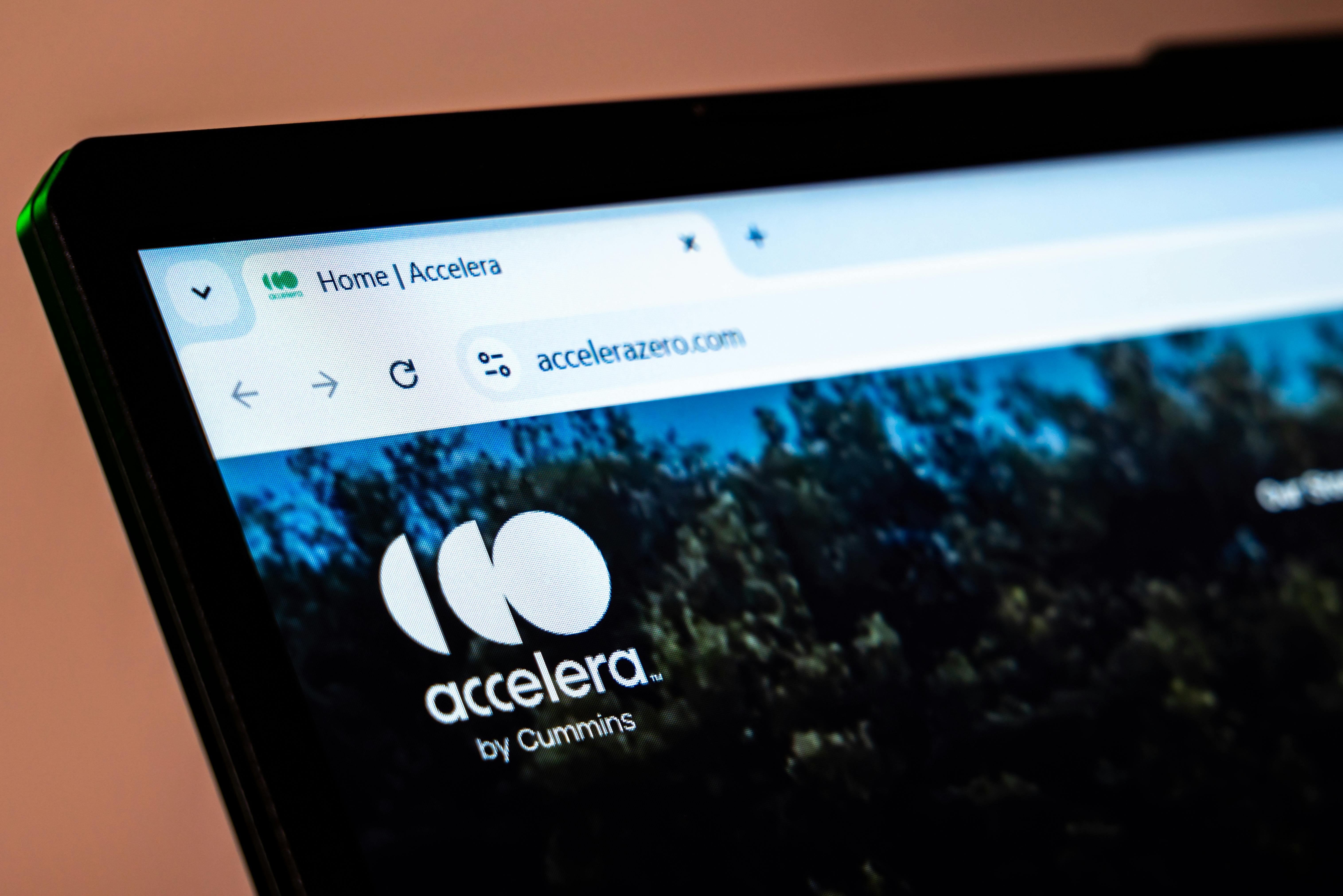 Accelera By Cummins website displayed on laptop screen.
