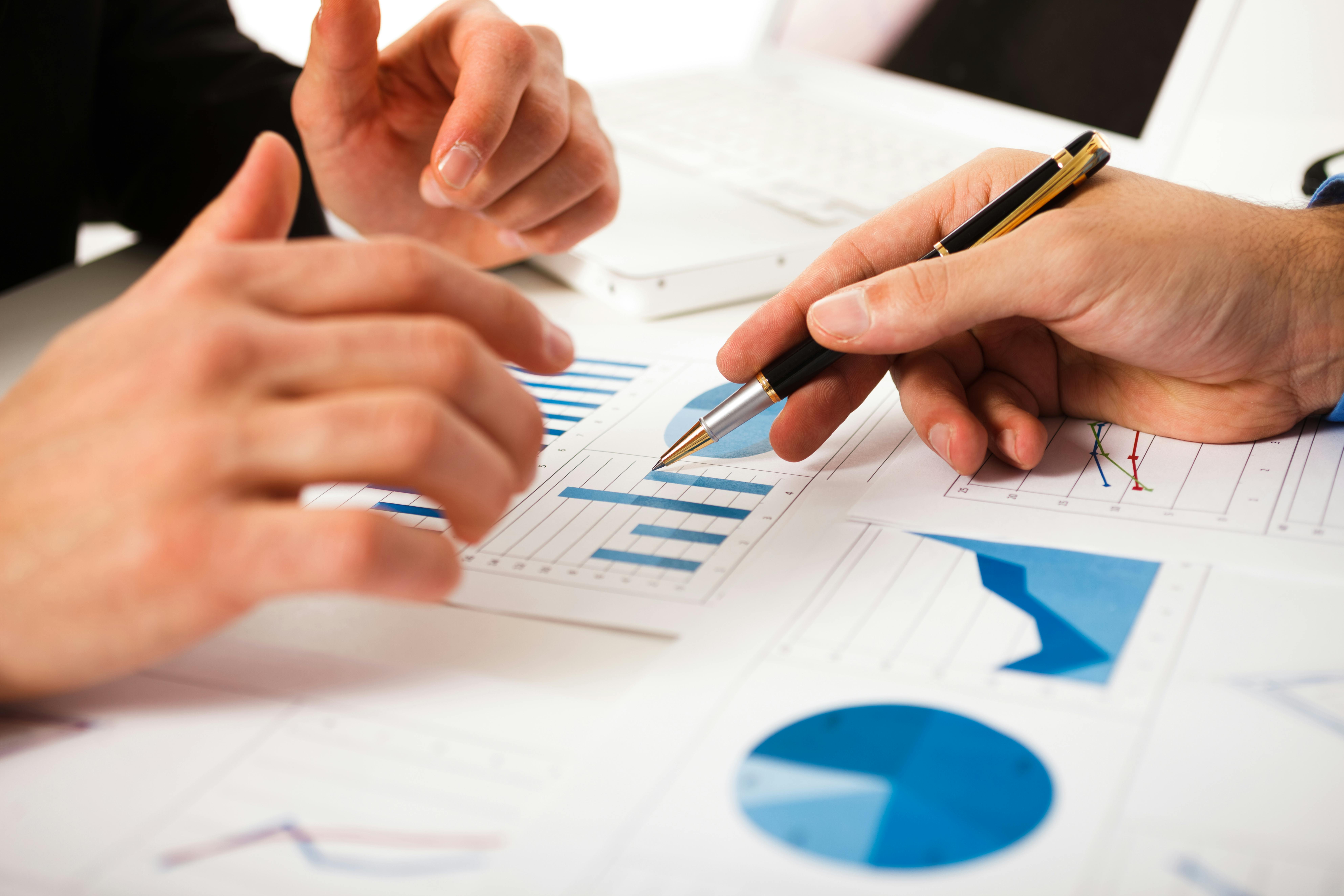 Business people discussing data during a meeting.