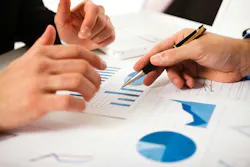 Business people discussing data during a meeting. Business people discussing data during a meeting.
