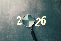 Looking ahead to the year 2026 with a magnifying glass. Looking ahead to the year 2026 with a magnifying glass.