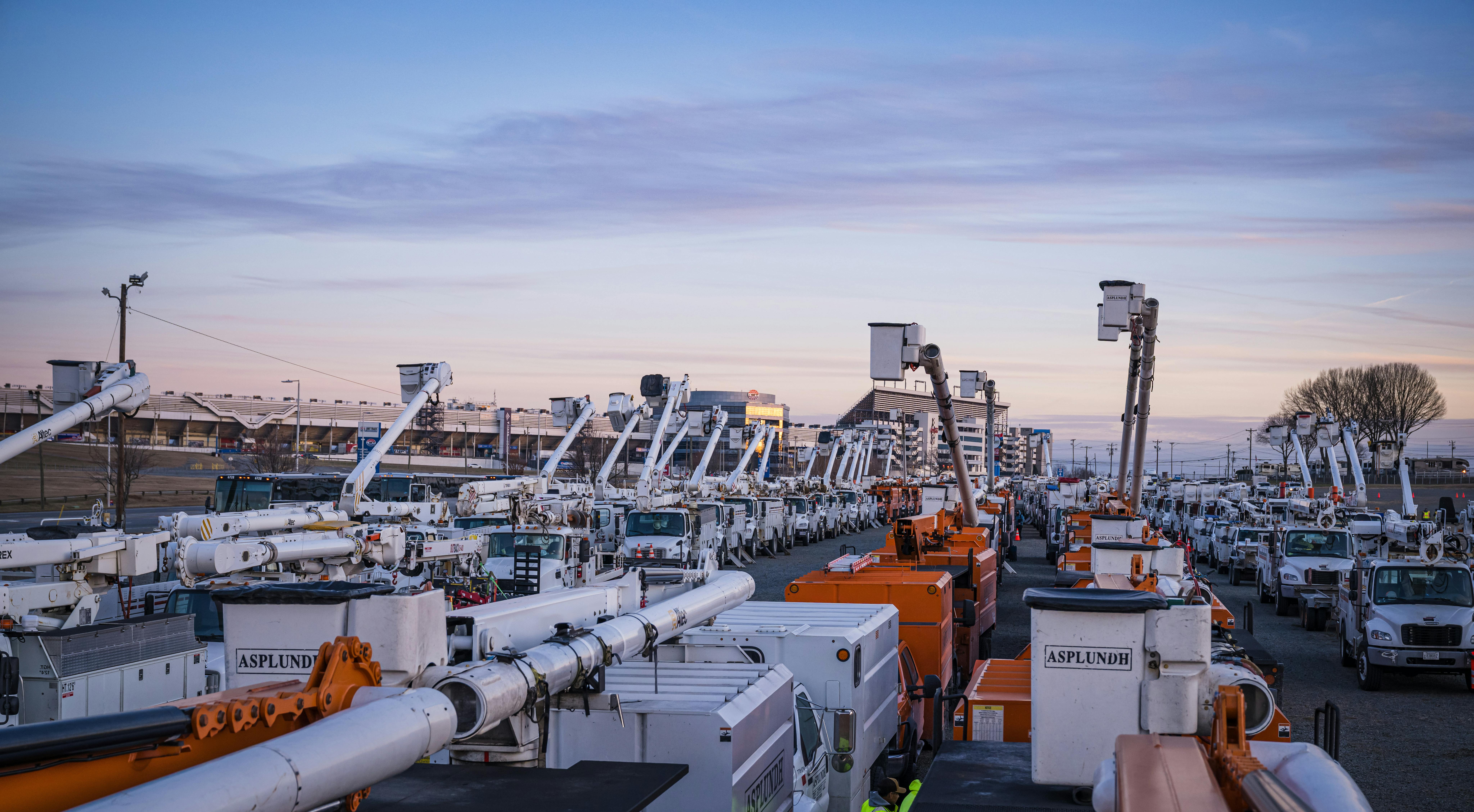 Utility bucket trucks at a Duke Energy basecamp at Charlotte Motor Speedway