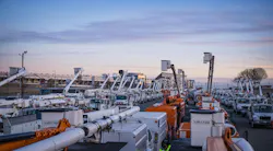 Utility bucket trucks at a Duke Energy basecamp at Charlotte Motor Speedway Utility bucket trucks at a Duke Energy basecamp at Charlotte Motor Speedway