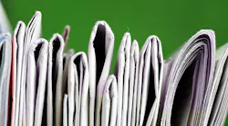 partial view of a stack of newspapers partial view of a stack of newspapers