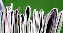 partial view of a stack of newspapers partial view of a stack of newspapers