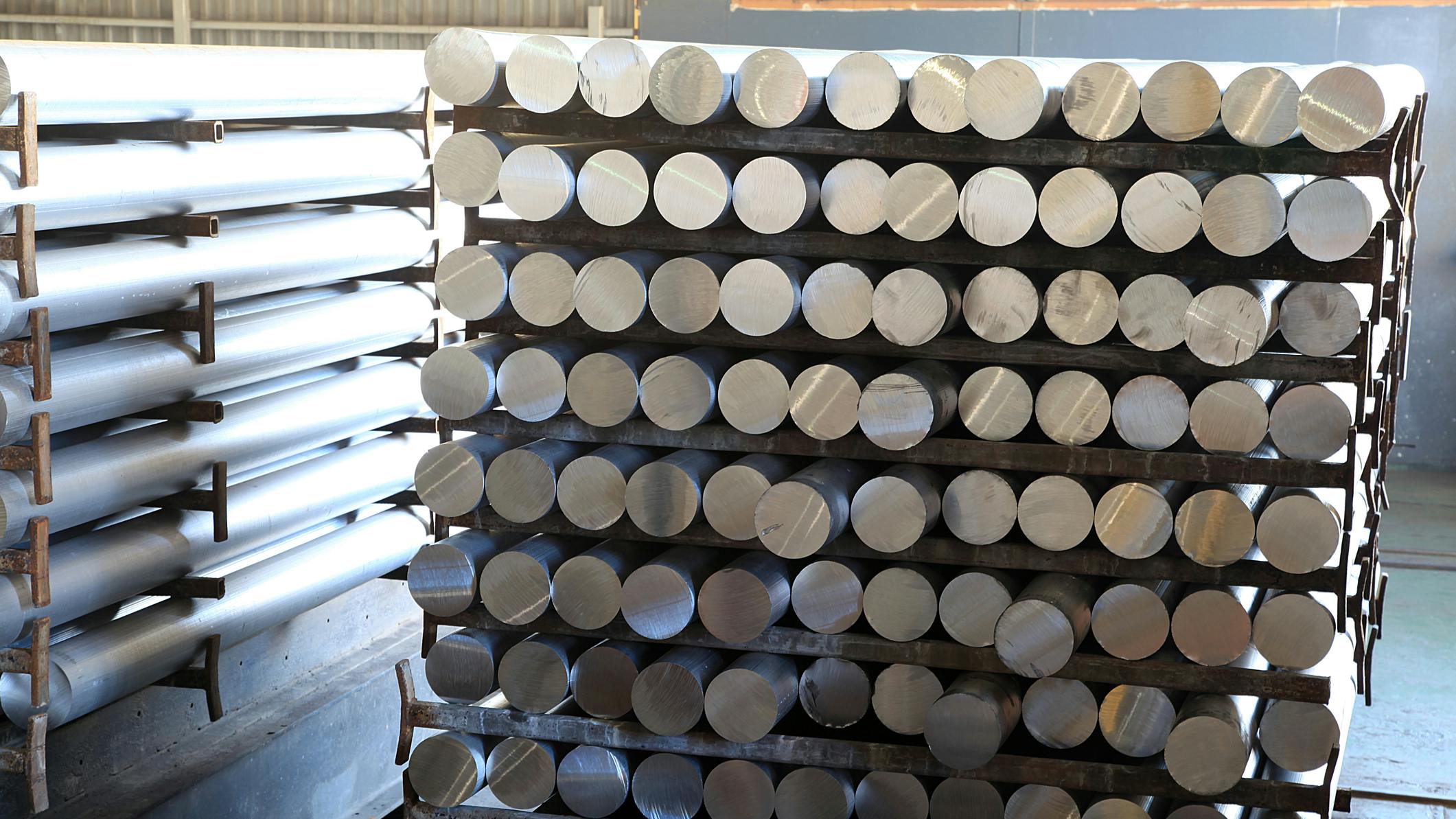 Aluminum rods made from recycled aluminum, used in the manufacturing of tool and die components.