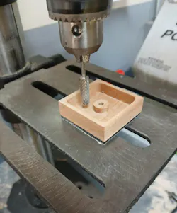 machine hollows out wood block to create part of the rubber stamp machine hollows out wood block to create part of the rubber stamp