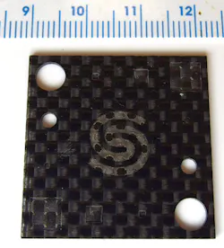 FIGURE 5. Surface texturing and hole drilling in CFRP without any visible fiber damage using the Quasar UV laser. FIGURE 5. Surface texturing and hole drilling in CFRP without any visible fiber damage using the Quasar UV laser.