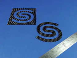 FIGURE 1. The Spectra-Physics logo cut in ~1mm-thick CFRP plate. FIGURE 1. The Spectra-Physics logo cut in ~1mm-thick CFRP plate.