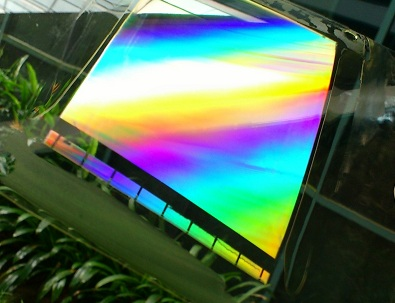 A nanoimprinted plastic film has patterned arrays of nanostructures imprinted on its surface.