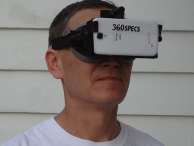 Ray Latypov, CEO of VirtuSphere, demonstrates the 360specs, which hold a smartphone to form a virtual-reality headset. The smartphone's position sensors, along with an app, ensure that the view turns as the viewer turns.