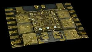 In the foreground are 2 Chalmers VCSELs; the one on the left has a 6 micron aperture and could operate error free up to 62 Gbps while the one on the right has a 5 micron aperture and set the equipment-limited record of 64 Gbps. Behind the two VCSELs is IBM's BiCMOS8HP VCSEL driver IC. On either side of the IC are the decoupling capacitors and connecting wirebonds.