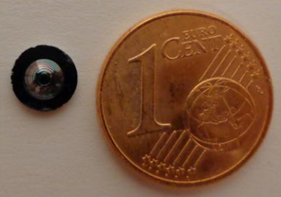 A Fresnel lens, 1 mm thick and with a diameter of a little less than 4 mm, is shown next to a Euro cent for comparison.