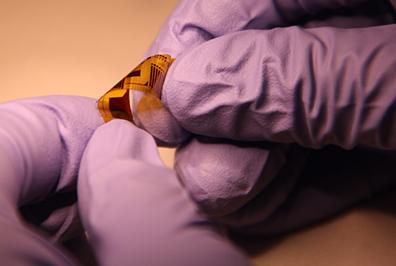 Photonic devices created of chalcogenide glass within a polymer are flexible and yet have very low optical losses.