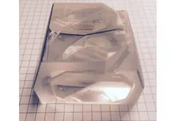 A macroscopic chamber holds a condensed photonic mesh. A macroscopic chamber holds a condensed photonic mesh.