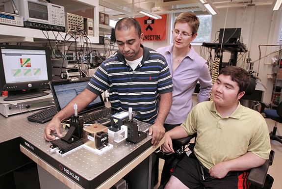 A new system developed by Princeton researchers uses a laser to allow diabetics to check their blood sugar without pricking their skin. Members of the research team included, from left, Sabbir Liakat, a graduate student in electrical engineering; Claire Gmachl, the Eugene Higgins Professor of Electrical Engineering; and Kevin Bors, who graduated in 2013 with a degree in electrical engineering.