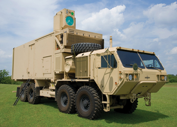 FIGURE 1. The U.S. Army's high-energy-laser mobile demonstrator (HEL-MD) shot down targets with a 10 kW fiber laser in tests at White Sands and Eglin AFB in Florida. Boeing supplied the acquisition, tracking, and beam-delivery optics that fire a beam through the portal on top of the Army's heavy expanded mobility tactical truck (HEMTT). Boeing will install a 60 kW laser for further tests.