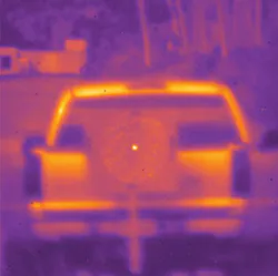 A Tm-fiber laser is shone on a truck 300 m away (top); the indium antimonide camera easily shows the fiber-laser beam as a bright spot in the center of the image, while the larger ring shows cladding light picked up by the sensitive camera. The Tm-fiber laser is powerful enough to be used for atmospheric propagation testing (bottom). Images after 1 km propagation match MODTRAN atmospheric-transmission simulations. A Tm-fiber laser is shone on a truck 300 m away (top); the indium antimonide camera easily shows the fiber-laser beam as a bright spot in the center of the image, while the larger ring shows cladding light picked up by the sensitive camera. The Tm-fiber laser is powerful enough to be used for atmospheric propagation testing (bottom). Images after 1 km propagation match MODTRAN atmospheric-transmission simulations.