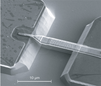 FIGURE 1. Scanning electron micrograph of an air-bridge Schottky barrier diode made at CNR-IFN shows that the metal connection between the anode pad and the Schottky junction has been suspended in order to reduce parasitic capacitance. The suspended structure was obtained by wet chemical removal of the GaAs under the metal bridge, after lithographic definition of the two mesas.