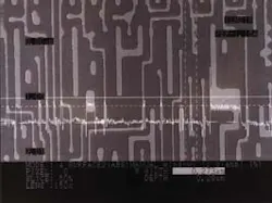 FIGURE 1. Confocal image contains a measurement of a 0.273-µm photoresist line on a silicon wafer taken at a 5600X magnification, equivalent to the resolution of a scanning electron microscope. The profile overlay is taken along the horizontal solid line. The width is measured at a 50% slice level, meaning that the measurement is made at the halfway point between the bottom and top of the resist line. This slice level can be adjusted between 5% and 95%, so the width can be measured at any elevation on the side wall that is required. The height of the photoresist line is 0.29 µm. The height, as well as the width, can be rapidly measured to a precision of 0.001 µm. The repeatability of measurement in the horizontal and vertical direction is 0.02 µm. FIGURE 1. Confocal image contains a measurement of a 0.273-µm photoresist line on a silicon wafer taken at a 5600X magnification, equivalent to the resolution of a scanning electron microscope. The profile overlay is taken along the horizontal solid line. The width is measured at a 50% slice level, meaning that the measurement is made at the halfway point between the bottom and top of the resist line. This slice level can be adjusted between 5% and 95%, so the width can be measured at any elevation on the side wall that is required. The height of the photoresist line is 0.29 µm. The height, as well as the width, can be rapidly measured to a precision of 0.001 µm. The repeatability of measurement in the horizontal and vertical direction is 0.02 µm.