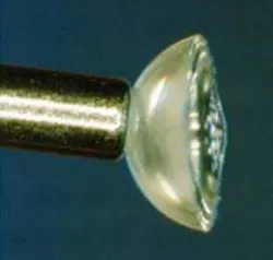 A 1.45-NA solid-immersion lens is the last element in a near-field optical-disc objective. The lens is 2 mm in diameter and 1 mm thick. An air-gap servo system controls the 40-nm gap between lens and disc without overshoot. A 1.45-NA solid-immersion lens is the last element in a near-field optical-disc objective. The lens is 2 mm in diameter and 1 mm thick. An air-gap servo system controls the 40-nm gap between lens and disc without overshoot.