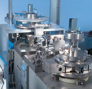 The GAMS4 was used by NIST to measure the angle at which gamma rays are diffracted by crystals with known lattice spacings. The two crystals are the metallic gray rectangular objects on round platforms in the foreground and background.