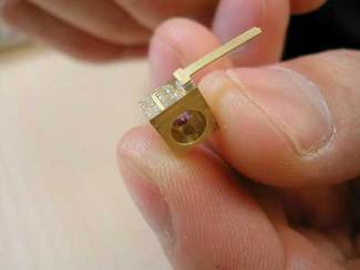 A quantum-cascade laser developed in a collaboration of Princeton University, UMBC, and AdTech Optics (City of Industry, CA) was grown without lateral regrowth using metal-organic chemical-vapor deposition and achieves room-temperature continuous-wave operation at 8.2 &micro;m. Such collaborations form the core and fabric of MIRTHE.