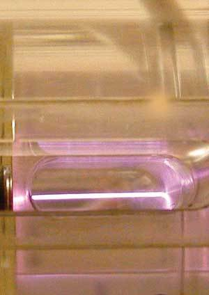 A 40 TW Ti:sapphire laser beam accelerates electrons in plasma within a capillary tube.