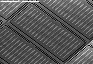 Each microshutter has a hinge on one side, which includes a silicon nitride torsion bar providing the spring tension to close the shutter when opening forces are removed. Magnetic cobalt-iron strips coat the upper face of each microshutter element. In use, a magnet is positioned underneath the array to first open all of the doors simultaneously; when the magnet is removed to enable imaging, elements that need to remain open are kept that way by computer-controlled voltage differences that can be turned on and off independently for each element in the grid.