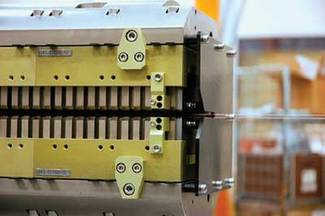 An undulator in the Linac Coherent Light Source comprises an array of neodymium iron boron permanent magnets and vanadium permendur magnetic poles.