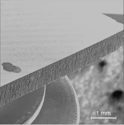 FIGURE 2. Fiber lasers are enabling new applications, including the machining of silicon wafers with negligible edge cracking compared to conventional laser processes. FIGURE 2. Fiber lasers are enabling new applications, including the machining of silicon wafers with negligible edge cracking compared to conventional laser processes.