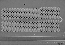 FIGURE 5. The first edge-emitting photonic-crystal (PC) nanocavity laser featured a PC double heterostructure that formed the laser cavity and consisted of several segments of single-line-defect PC waveguides in triangular lattices. The devices were fabricated in a 220-nm-thick gallium arsenide membrane embedded with five layers of indium arsenide quantum dots as the active material. FIGURE 5. The first edge-emitting photonic-crystal (PC) nanocavity laser featured a PC double heterostructure that formed the laser cavity and consisted of several segments of single-line-defect PC waveguides in triangular lattices. The devices were fabricated in a 220-nm-thick gallium arsenide membrane embedded with five layers of indium arsenide quantum dots as the active material.