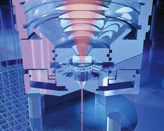 FIGURE 1. In one example of a water-jet-guided laser cutting system, the end of a high-power delivery fiber coupled to the laser is imaged into the nozzle through a window and a layer of pressurized water.