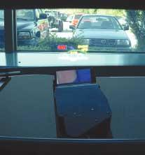 A prototype laser-scanning head-up display projects full-color information onto an automobile windshield. As well as having advantages in size and weight, the new system can be used in different car models without modifying the basic optics.