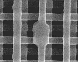 FIGURE 1. A 0.3-µm2 defect in a 3-D multiple-quantum-well photonic crystal serves as a cavity that emits 1550-nm light. FIGURE 1. A 0.3-µm2 defect in a 3-D multiple-quantum-well photonic crystal serves as a cavity that emits 1550-nm light.
