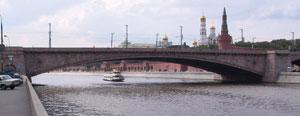 FIGURE 1. The Bolshoi Moskvoretsky Bridge in Moscow, built between 1936 and 1937 near the Kremlin, is part of one of the city's major traffic lines. The bridge consists of three parallel, 100-m-long, reinforced-concrete arches hidden -behind stone walls. Two types of degradation have been detected: settlement in the -center of the arch, which caused cracking of the stone walls near the abutments on both sides of the bridge, and chloride diffusion transversing the upper wall of the arch -boxes. In 2003, 16 interferometric sensors (produced by Smartec) were installed to -continuously monitor structural behavior of the bridge, increase safety, and reduce maintenance costs.