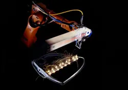 FIGURE 2. The thin-disk-laser beam quality of 8 mm mrad (independent from the output power level) has proven to be the key factor in the development of new remote-laser welding applications. Remote-laser welding allows the welding of car body and other metal parts by using a two-axis scanner that is placed about 50 cm above the weld joint. The robot coarsely positions the scanner, while the scanner can position the laser beam accurately within its scanning field at very high positioning speeds. FIGURE 2. The thin-disk-laser beam quality of 8 mm mrad (independent from the output power level) has proven to be the key factor in the development of new remote-laser welding applications. Remote-laser welding allows the welding of car body and other metal parts by using a two-axis scanner that is placed about 50 cm above the weld joint. The robot coarsely positions the scanner, while the scanner can position the laser beam accurately within its scanning field at very high positioning speeds.
