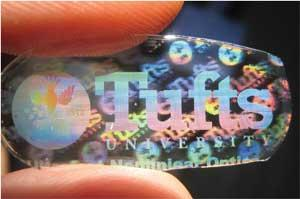 FIGURE 1. A paper in the BiOS Symposium at Photonics West shows how the biocompatible nature of silk allows seamless embedding of active optics in everyday objects. The readout is provided by the optical element, for example, as a color or image change; when something unwanted is present (such as E. coli bacteria), the color changes or the holographic images disappear.