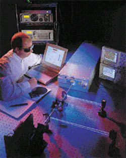 Improvements in the efficiency of frequency conversion, together with more reliable laser-diode pump sources, have enabled UV diode-pumped lasers to compete in markets formerly dominated by ion lasers. Here a technician prepares a 4-W, 355-nm laser for an industrial customer. Improvements in the efficiency of frequency conversion, together with more reliable laser-diode pump sources, have enabled UV diode-pumped lasers to compete in markets formerly dominated by ion lasers. Here a technician prepares a 4-W, 355-nm laser for an industrial customer.