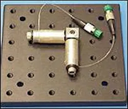 FIGURE 1. Multimode fiber is coiled on two spools oriented orthogonally to provide equal suppression of the two helical polarities of the LP11 mode and maintain diffraction-limited beam quality. FIGURE 1. Multimode fiber is coiled on two spools oriented orthogonally to provide equal suppression of the two helical polarities of the LP11 mode and maintain diffraction-limited beam quality.