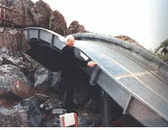FIGURE 2. Photocell on flume ride triggers picture taking as riders approach water. FIGURE 2. Photocell on flume ride triggers picture taking as riders approach water.