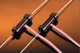 FIGURE 1. Fiberoptic variable attenuator based on a side-polished fiber architecture can be electronically controlled with no moving parts. Insertion loss and backreflection are near-zero.