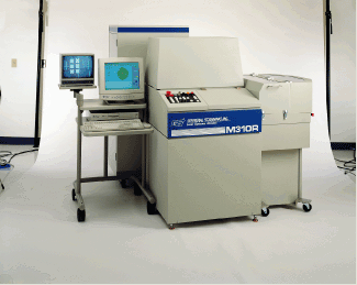 FIGURE 1. Laser trim system provides high-throughput trimming of precision semiconductor integrated passive components.