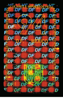 Hologram used as a registration sticker in Mexico City has a custom amber coating that makes the hologram hard to duplicate; a 'high-tack' security adhesive makes it impossible to remove intact from the windshield.