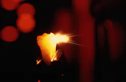 FIGURE 1. The ultrashort-pulse Er:YAG laser has been shown to be optimum for hard-tissue work in dentistry. Beam coming from right is 350 mJ at 250 µs. FIGURE 1. The ultrashort-pulse Er:YAG laser has been shown to be optimum for hard-tissue work in dentistry. Beam coming from right is 350 mJ at 250 µs.